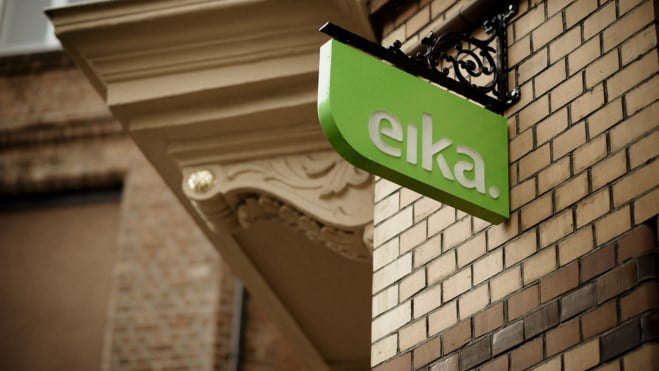 Grønt Eika skilt på bygning. foto